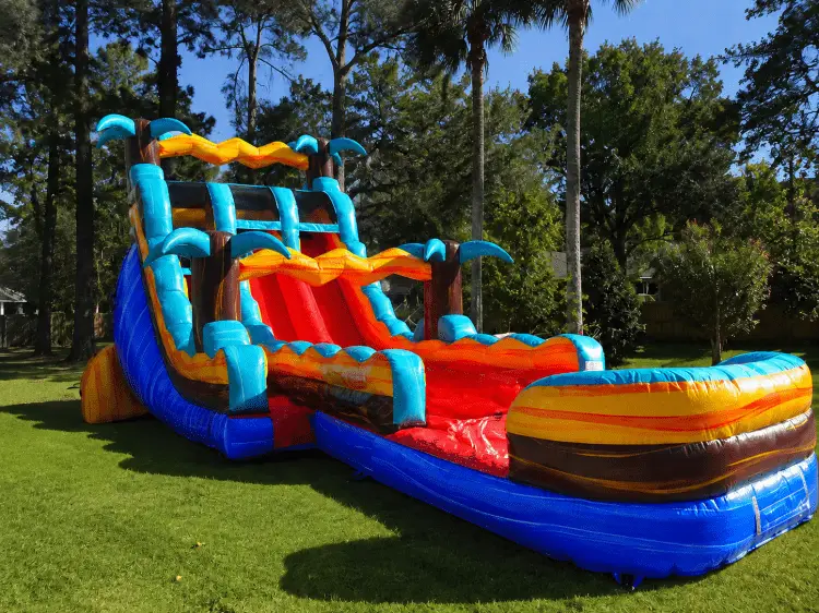 Colorful inflatable water slide rental setup for outdoor parties in Summerville SC