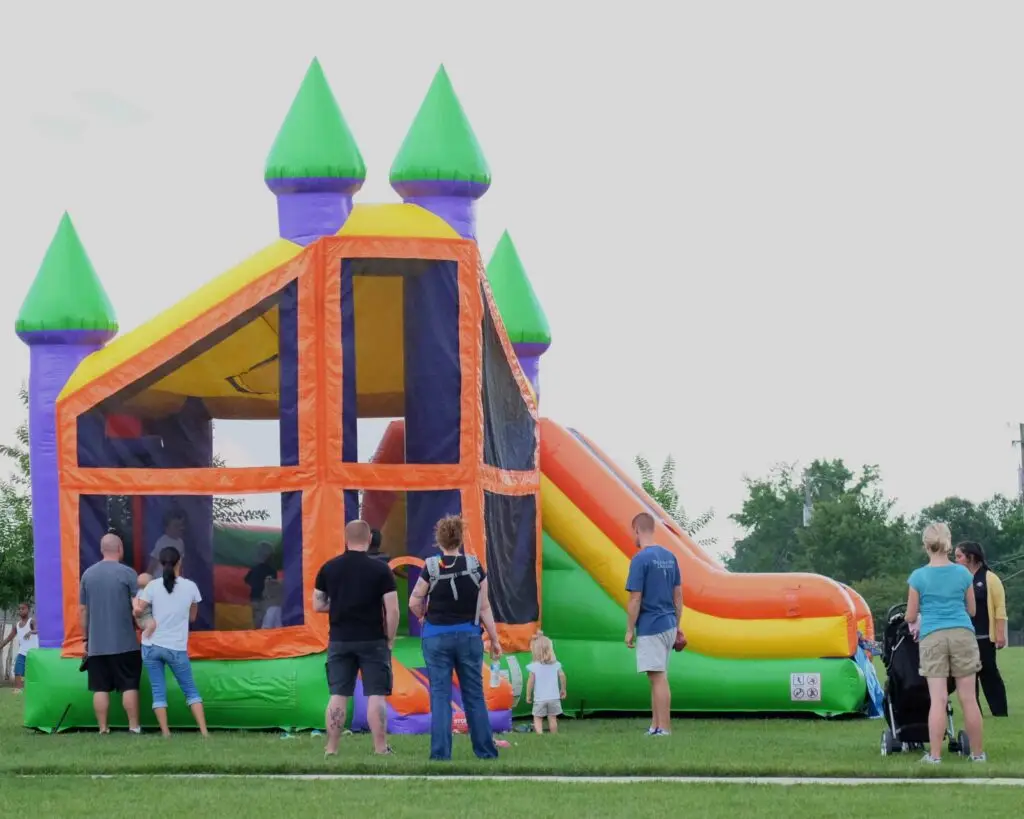 Inflatable bounce house with slide setup for outdoor events